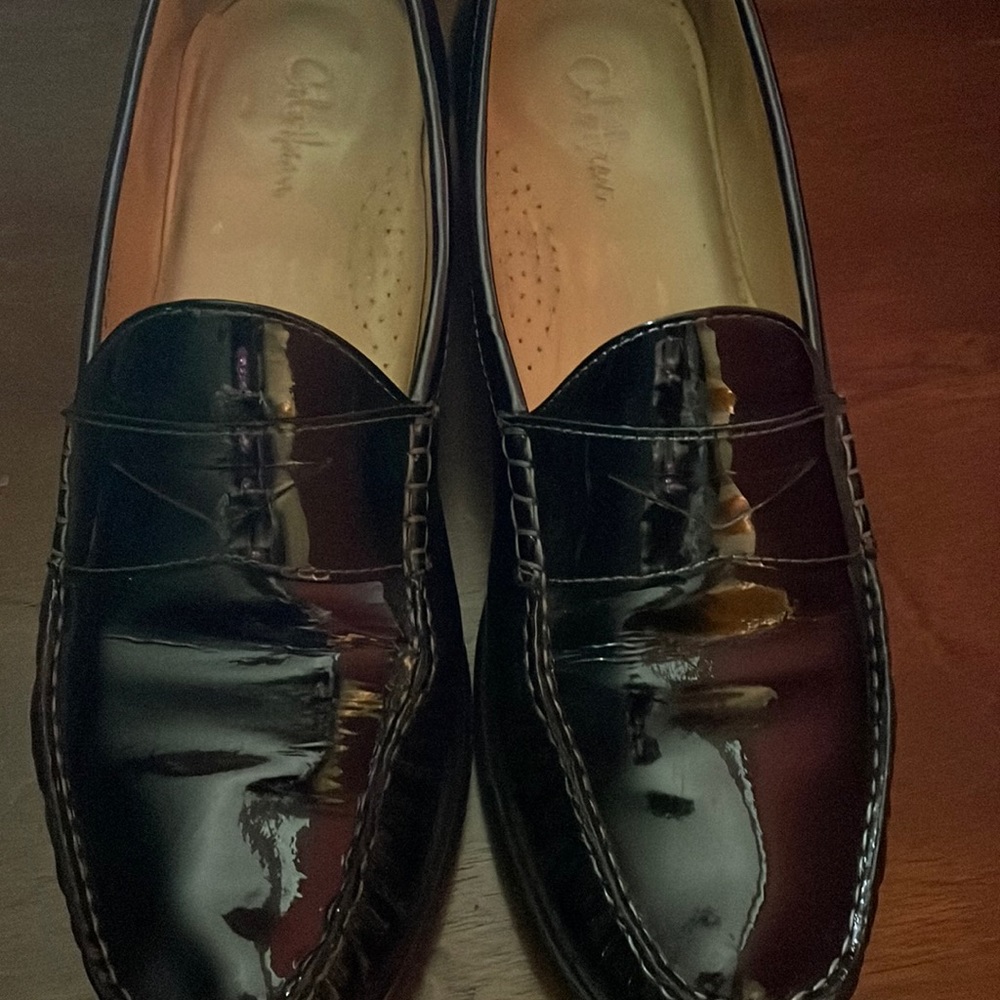Black leather loafers (slightly torn and mended)